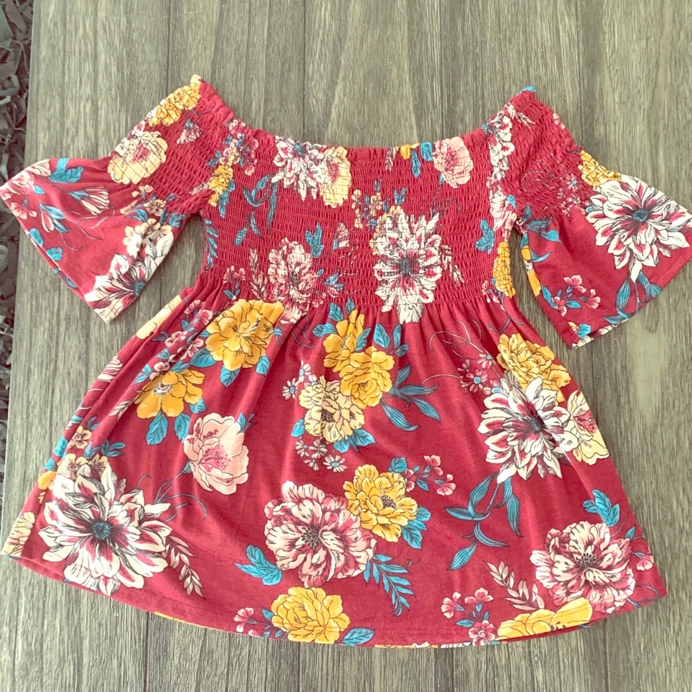 Off shoulder bohemian baby doll style top.